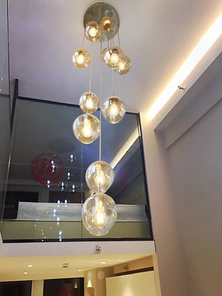 Cognac tinted glass globes on a gold chassis spiral chandelier