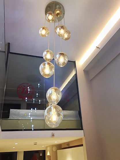 Cognac tinted glass globes on a gold chassis spiral chandelier