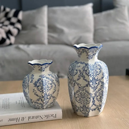Hand-painted blue and white porcelain vase in ivory on wooden console