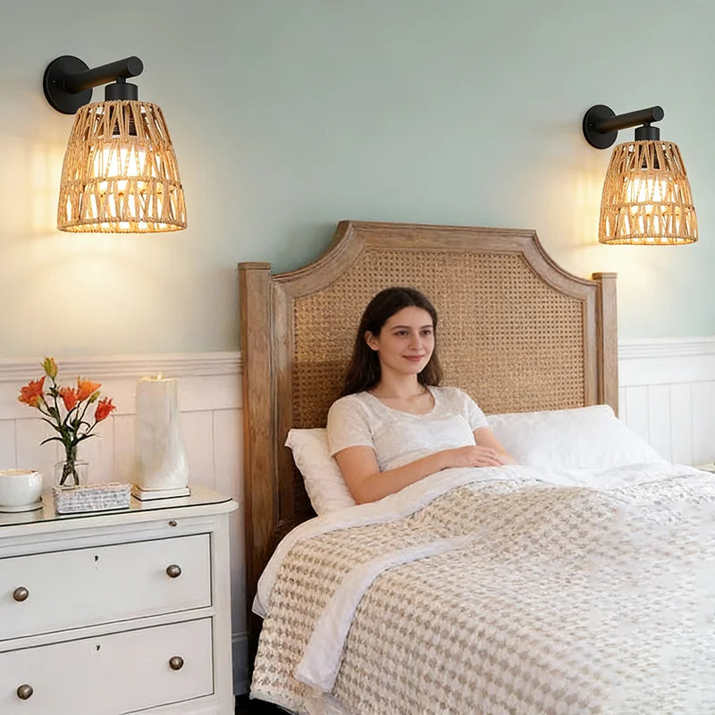black rattan plug-in wall sconce, installed in a room interior setting