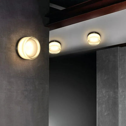 acrylic outdoor wall sconce, detail view of fixture base and arm