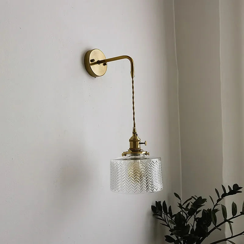 green copper wall sconce, detail view of fixture base and arm