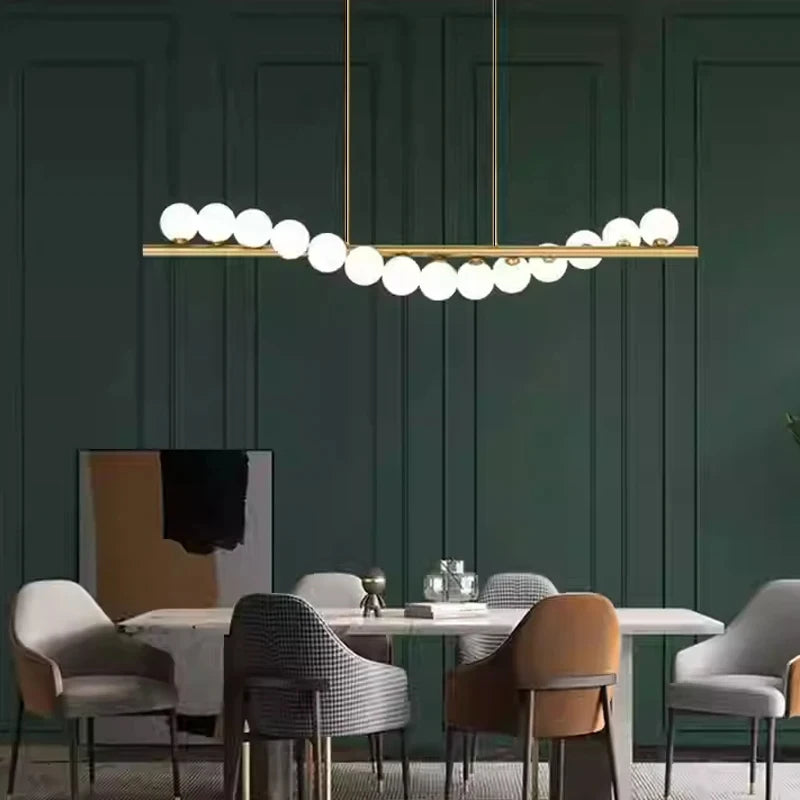 Glass bubble chandelier with rounded white shades on painted iron stems