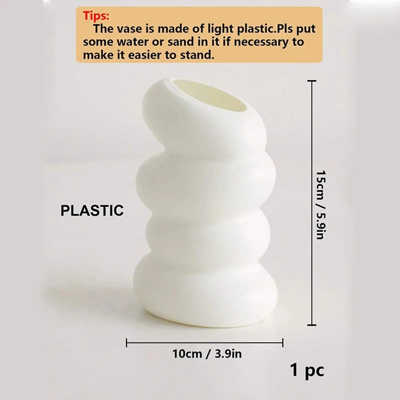 Side view of white spiral plastic vase showing graceful twisted silhouette