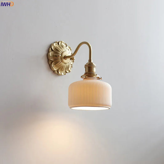 copper bathroom wall sconce, front view on white background