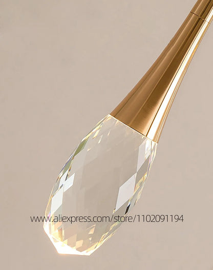 Remote dimmable crystal chandelier in polished gold for a loft stairwell
