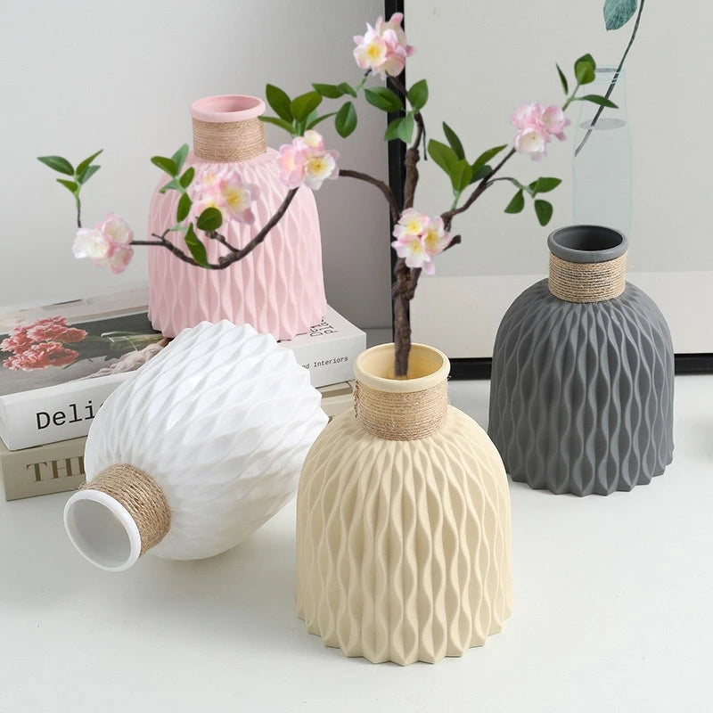 Pink plastic flower vase with pineapple texture and natural twine rope accent