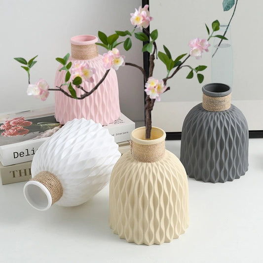 Pink plastic flower vase with pineapple texture and natural twine rope accent