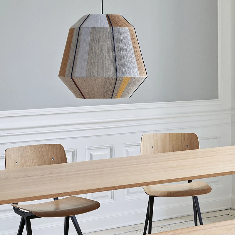 Bamboo and wood chandelier shade on a slim iron frame