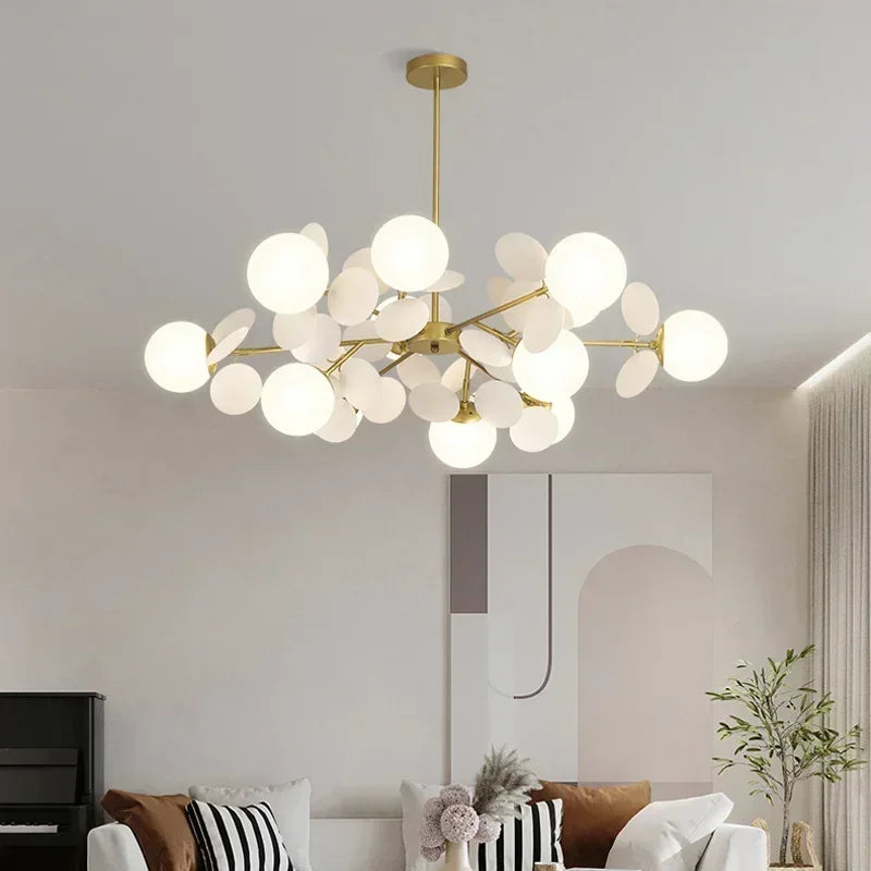 White painted branch chandelier with flower like globes on slim arms