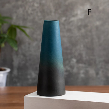 Small frosted ceramic vases in four styles arranged as a flat lay comparison display