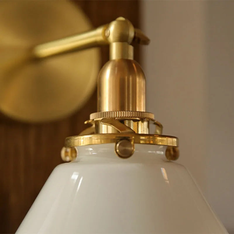 glass bathroom wall sconce, installed in a room interior setting