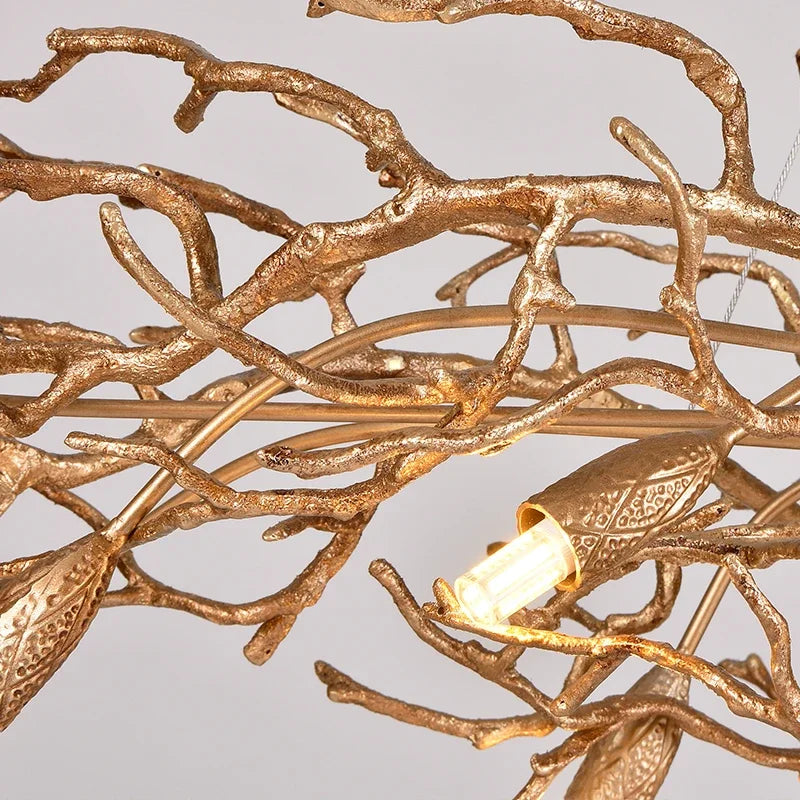 Retro branch chandelier seen from below with crystal glass on gold arms