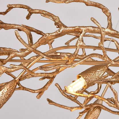 Retro branch chandelier seen from below with crystal glass on gold arms