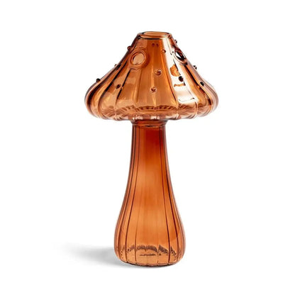 Gold mushroom vase styled with crystals and botanicals on boho shelf display