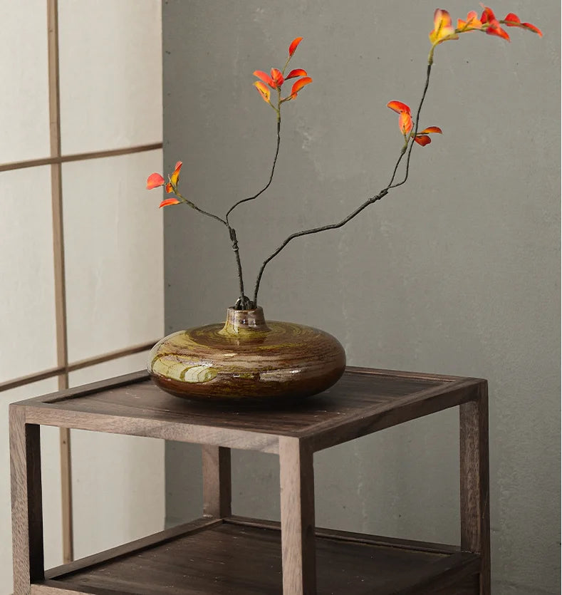 Rustic ceramic vase styled in zen meditation home interior