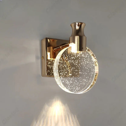 crystal bathroom wall sconce, detail view of fixture base and arm