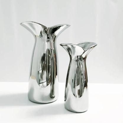 Small wabi-sabi electroplated Nordic vase with irregular organic form on console table