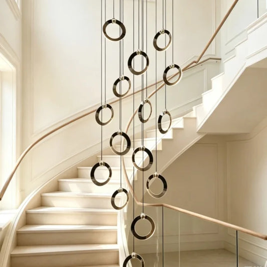 Modern ring staircase chandelier with slim aluminum rings hung on cords