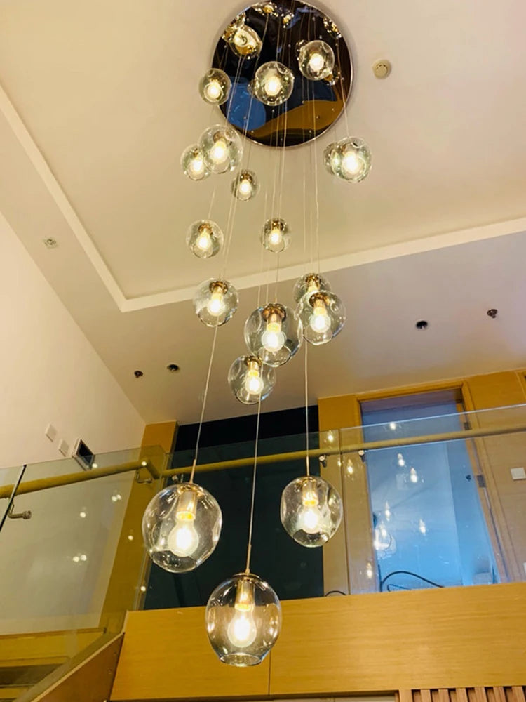 Spiral glass globe chandelier with tinted globes on a metal chassis