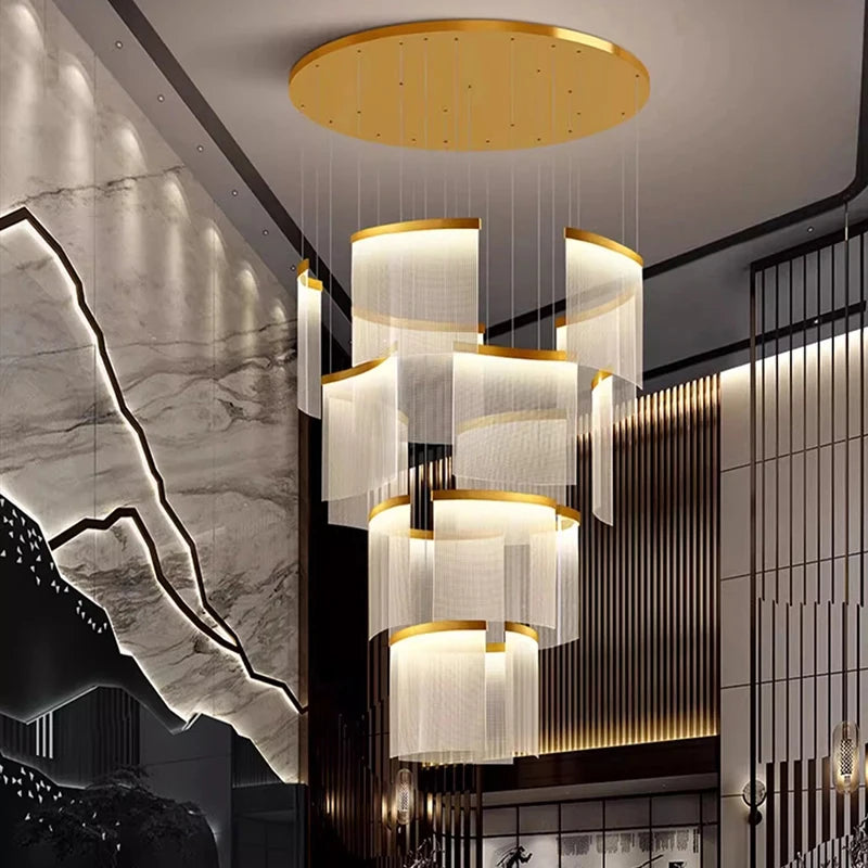 Gold framed acrylic heads tiered down an open stair void