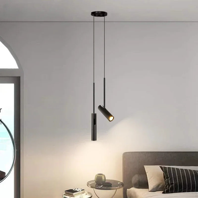 Minimalist spotlight chandelier with a slim aluminium head on a cord drop