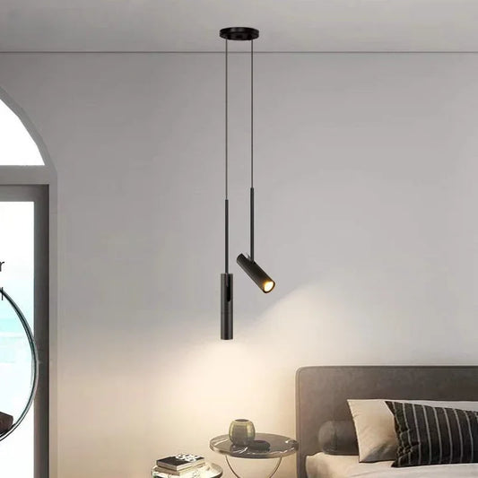 Minimalist spotlight chandelier with a slim aluminium head on a cord drop