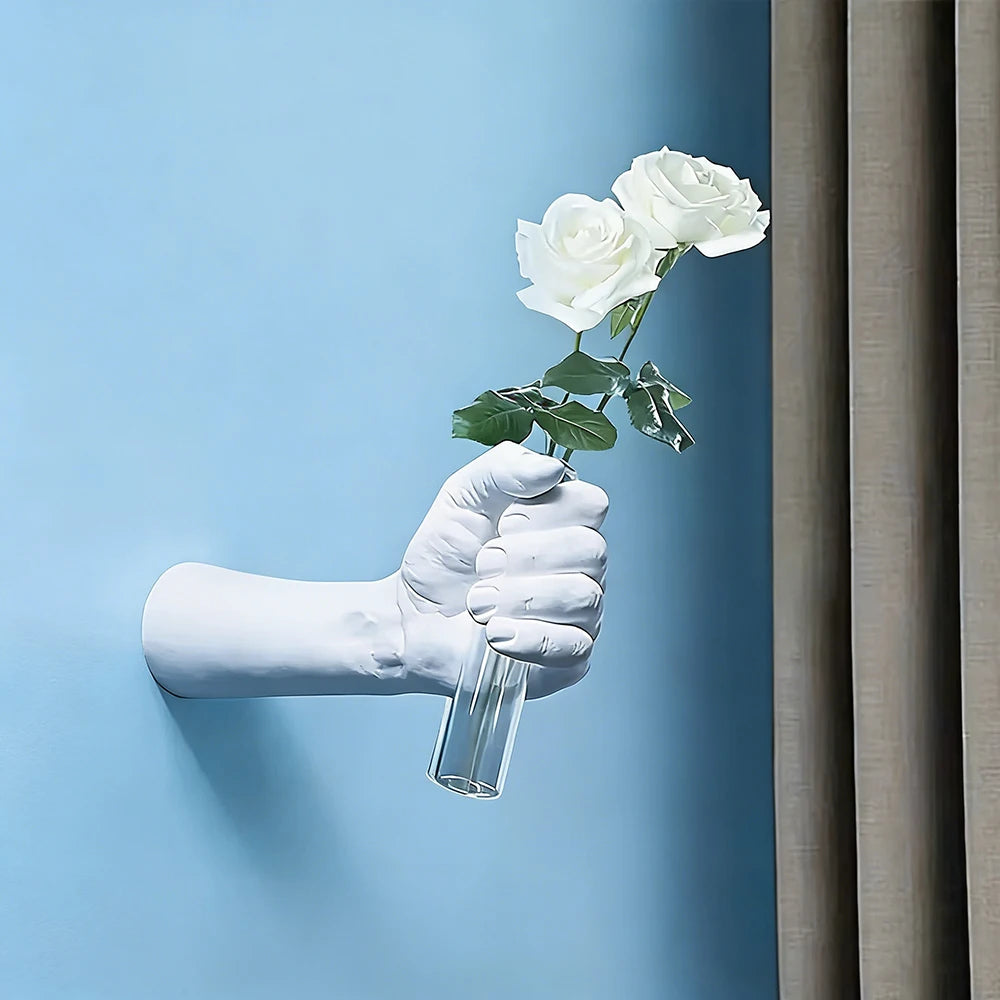 Multiple resin boxer fist wall vases arranged in art gallery wall cluster