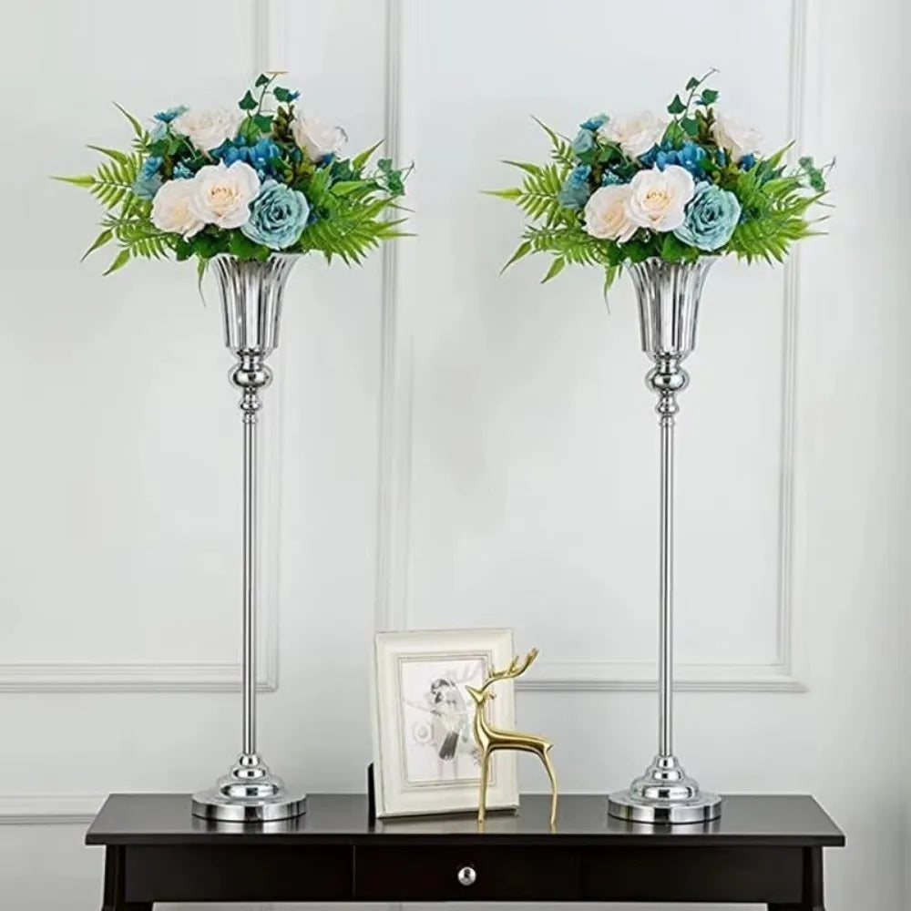 Small silver metal luxury flower stand vase on console table in contemporary interior