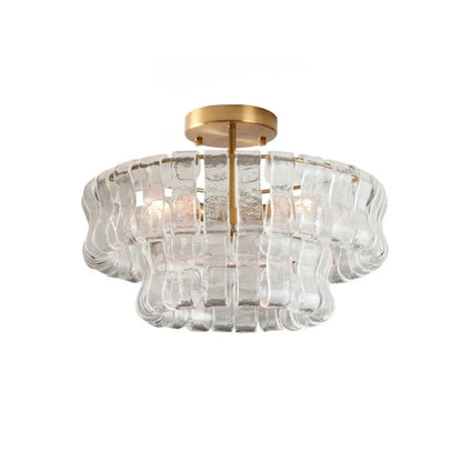 Glass chandelier seen from below with up and down light on a gold frame