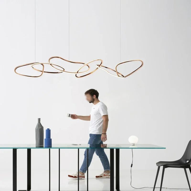 Spun stainless steel chandelier circles directing light straight downward