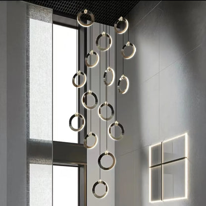 Black and gold ring staircase chandelier with acrylic light diffusers