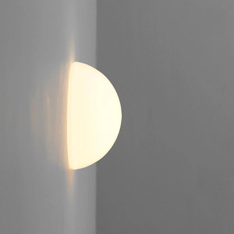 glass bathroom wall sconce, close-up of shade and hardware detail