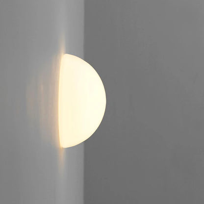 glass bathroom wall sconce, close-up of shade and hardware detail