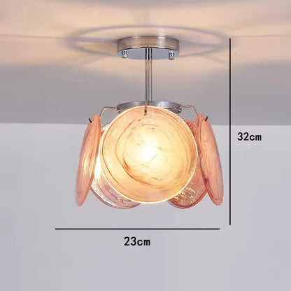 Matching Murano stained glass wall lamp on a polished steel bracket