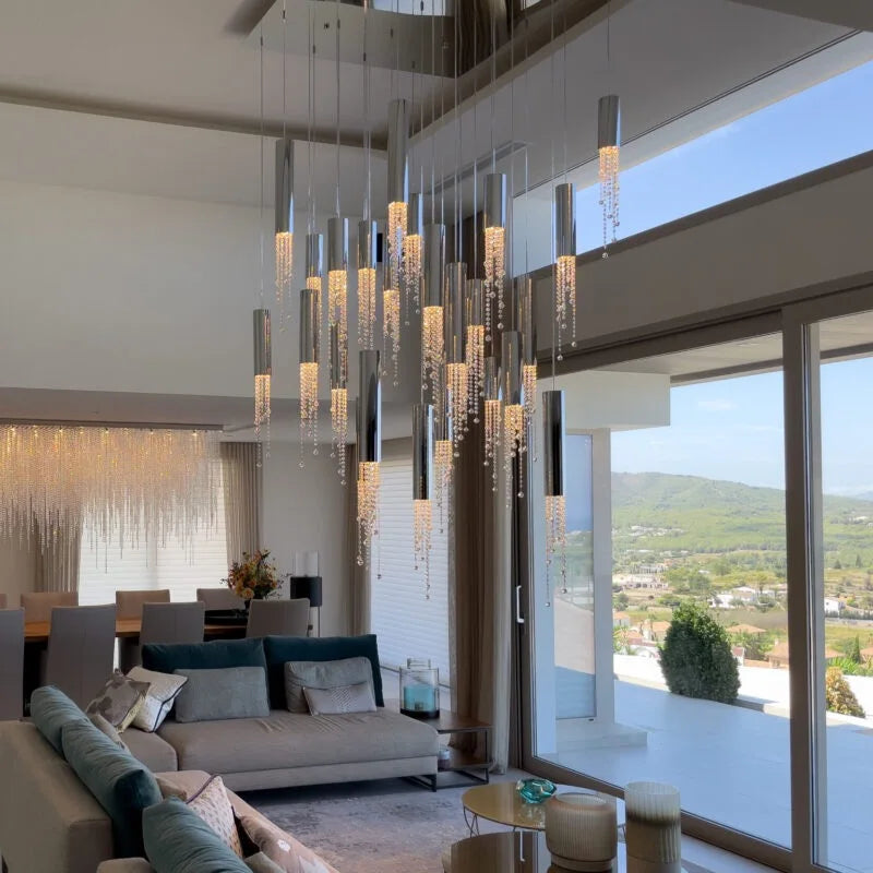 Large crystal staircase chandelier on brushed stainless suspension wires