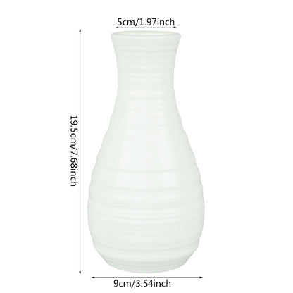 Three Nordic white plastic flower pots in natural light with assorted small houseplants