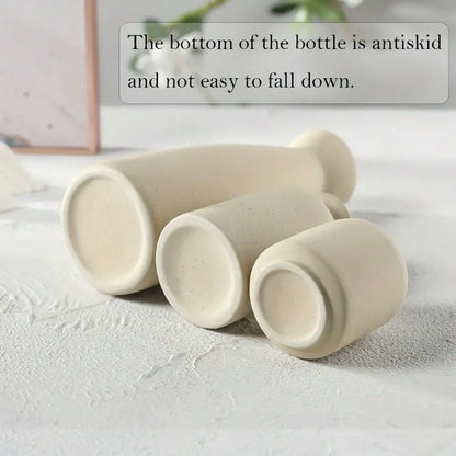 White bohemian ceramic vase set styled in Scandi minimalist interior