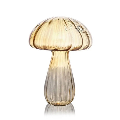 Brown and yellow mushroom glass vases side by side on natural linen cloth