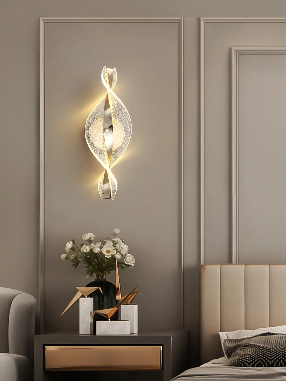 gold and black acrylic outdoor wall sconce, detail view of fixture base and arm