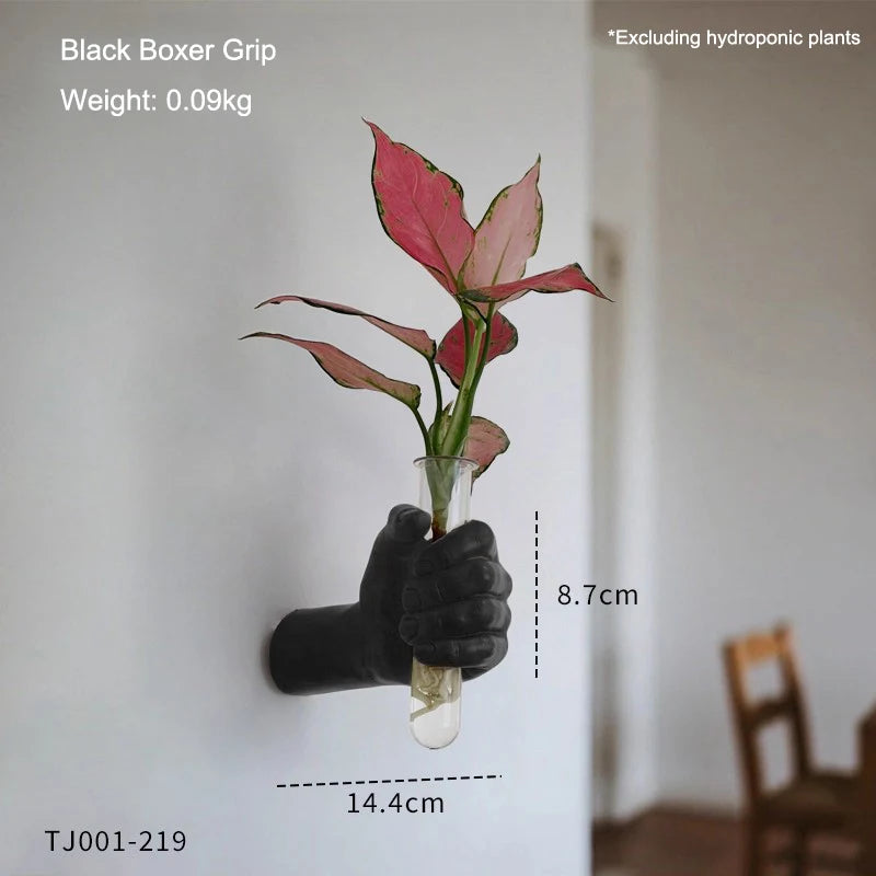 Flat lay of multiple resin boxer grip wall vase character variants together