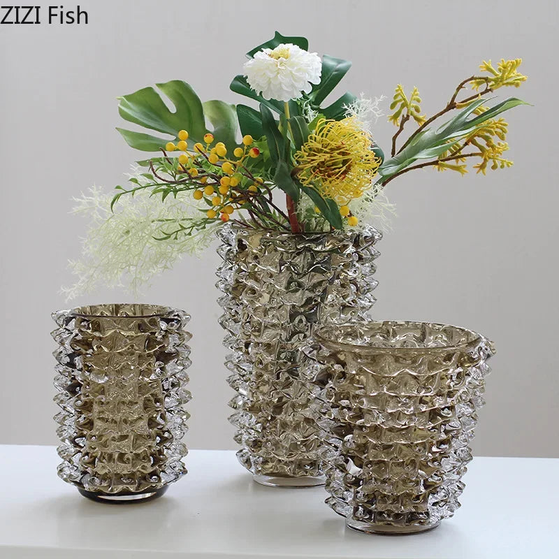 Textured wrinkle glass vase with flower arrangement on desk