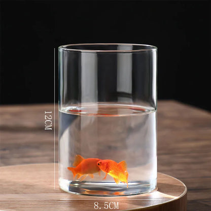 Glass cylinder vase used as candleholder with tea light inside