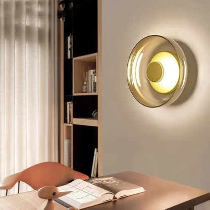 glass wall sconce, installed in a room interior setting