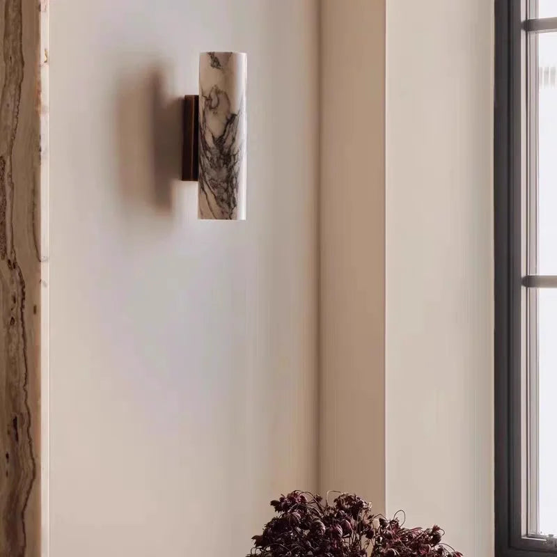 marble wall sconce, installed in a room interior setting
