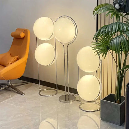 Chrome metal base and stand close-up detail of acrylic ball floor lamp