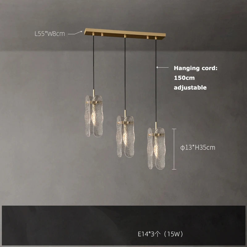 Matching water ripple glass wall lamp in a gold steel finish