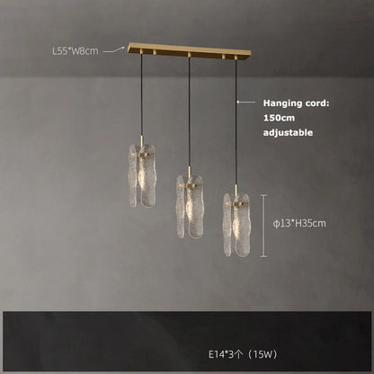 Matching water ripple glass wall lamp in a gold steel finish