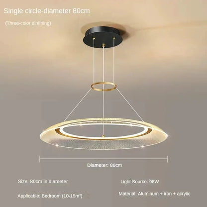 Cord pendant spiral ring chandelier with a polished gold canopy