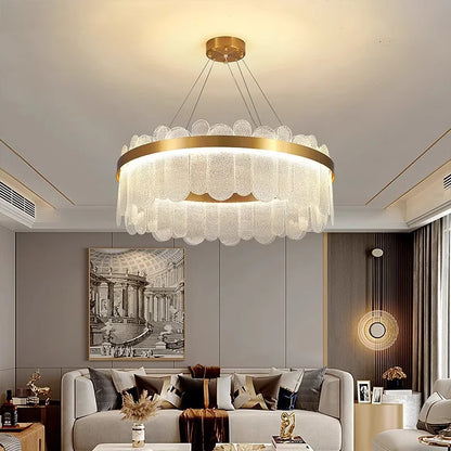 Round gold chandelier at 15.7 in across, flush mounted to the ceiling